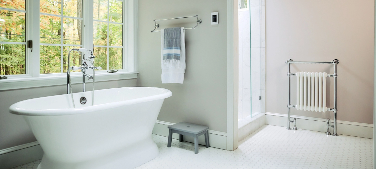 1-a-clean-bright-bathroom-featuring-a-freestanding-tub-under-a-large-window