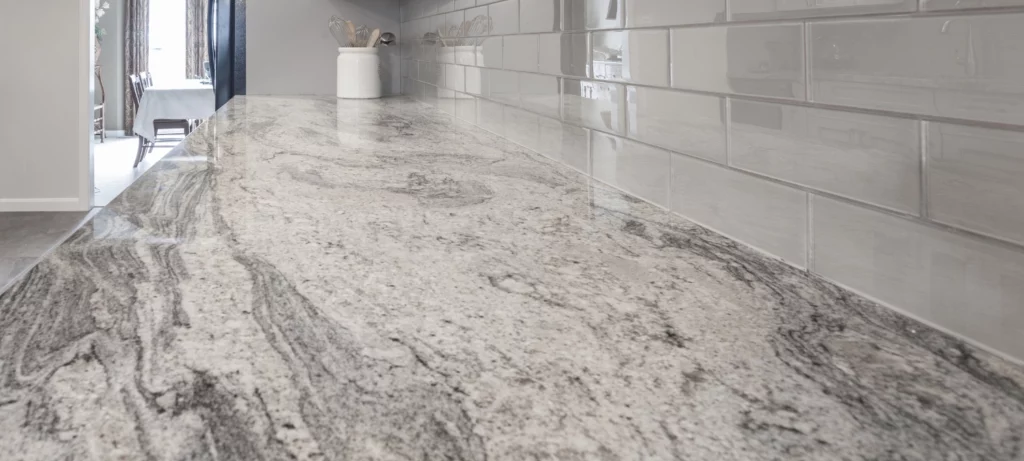 1-close-up-image-of-a-modern-kitchen-showing-a-sealed-granite-countertop-meeting-a-subway-tile-backsplash